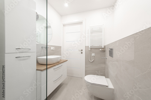 Modern Home Minimalist Bathroom Interior With Wooden Vanity and Sleek Wall Fixtures