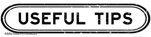 Grunge black useful tips word rubber seal stamp on white background