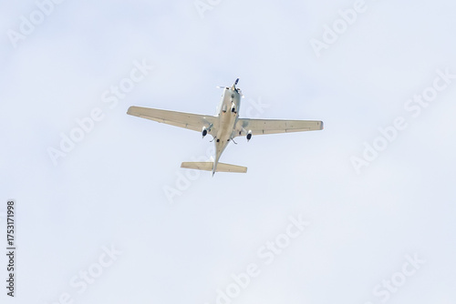 Small plane. A single engine plane crosses the blue sky. Transportation.