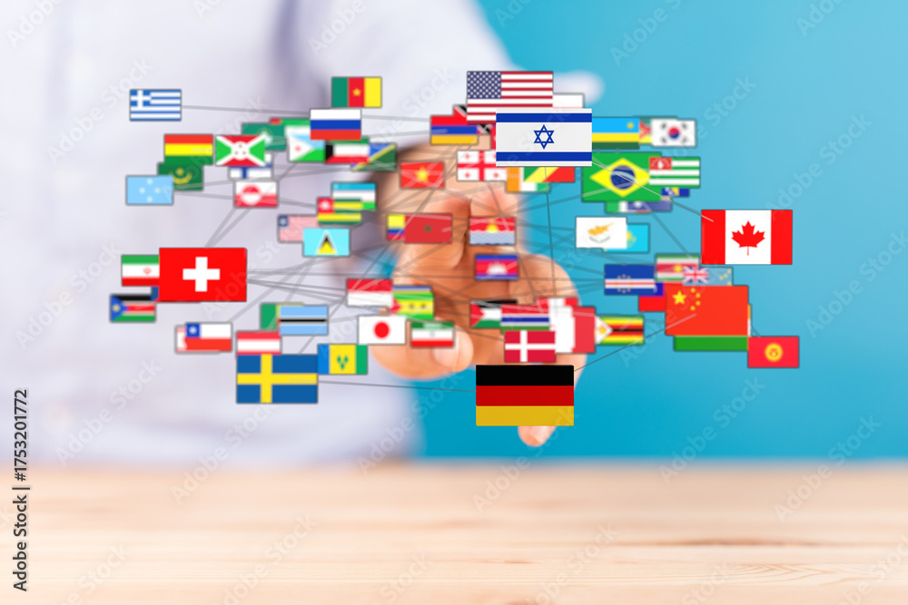 Obraz premium A hand connected to various world flags, representing globalization, international relations, and unity. A symbol of global cooperation, cross-c