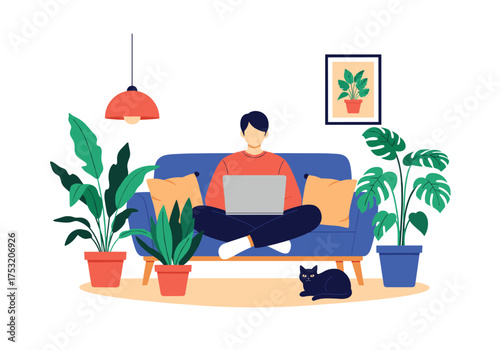 A man works on his laptop while sitting on a sofa surrounded by houseplants and his cat.