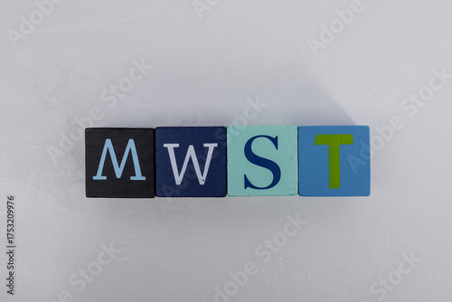Four wooden blocks with the...