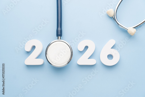 Stethoscope with 2026 number on blue background. Happy New Year for health care and medical banner calendar cover. Creative idea for new trend in medicine treatment and diagnosis concept.
