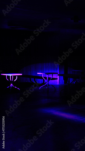 Mysterious Darkened Room with Striking Blue and Purple Neon Lit Tables
