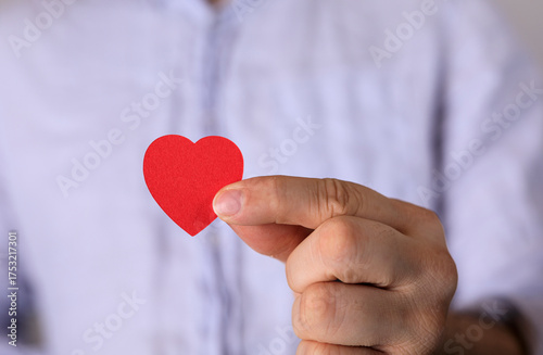 Close-up of a hand gently h...