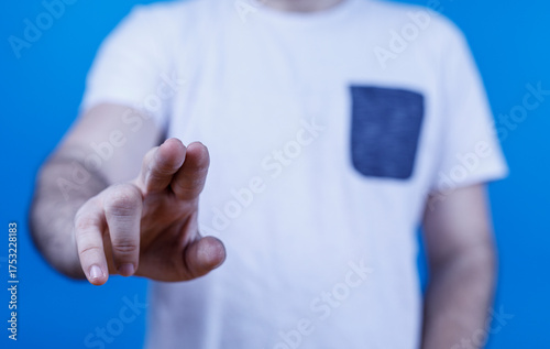 A man's hand reaching out t...