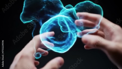 A person's hands interact with a glowing blue digital hologram of a biological cell, symbolizing future technology and scientific innovation