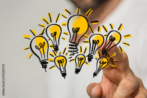 A hand holding a cluster of...