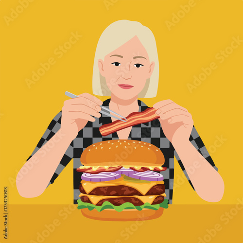 Woman assembling a large, multi-layered hamburger with bacon using tweezers