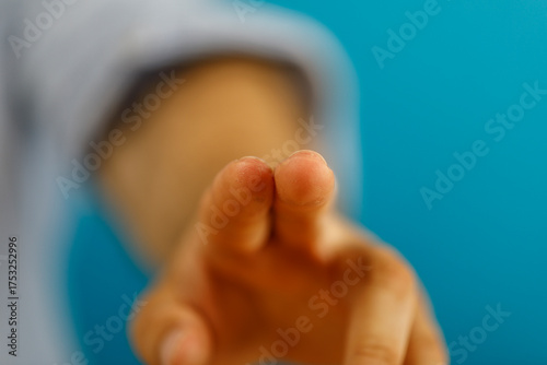 Close-up of a hand with two...