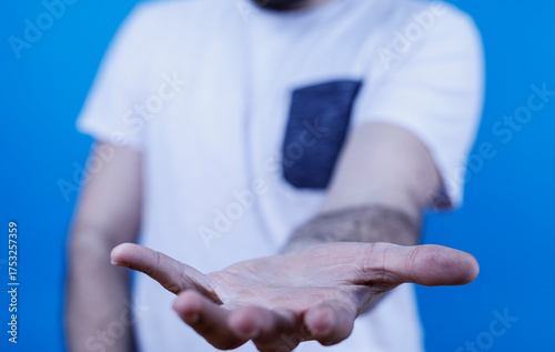 Image of a man's open hand,...
