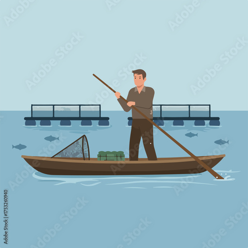 Man in boat paddles near fish farm structures and fish