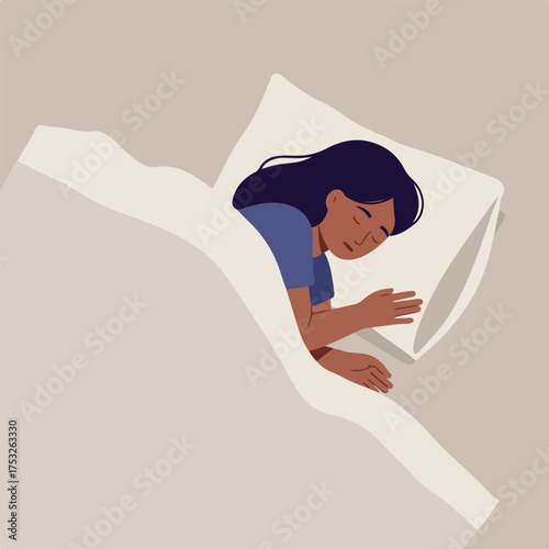 Person sleeping peacefully under a blanket on a pillow