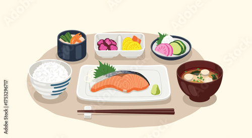 A traditional Japanese breakfast with grilled salmon rice and miso soup.