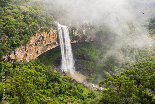 A view of Cascata do Caracol waterfall with fog at Caracol Park - Canela, Brazil