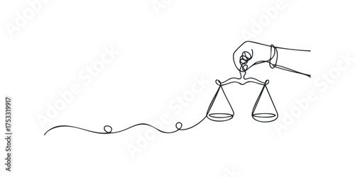 Hand holding scales of justice symbol