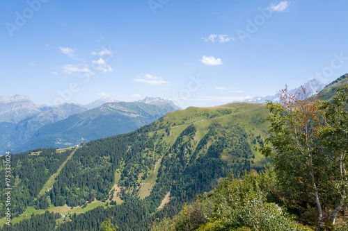 This landscape photo was taken in Europe, France, Auvergne Rhone Alpes, Haute Savoie, in summer. We can see the mountains, under the Sun.