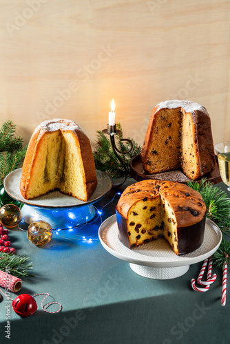 Different types of sweet Italian panettone cakes on a festive Christmas table