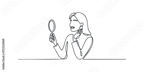 Woman examining herself in a handheld mirror