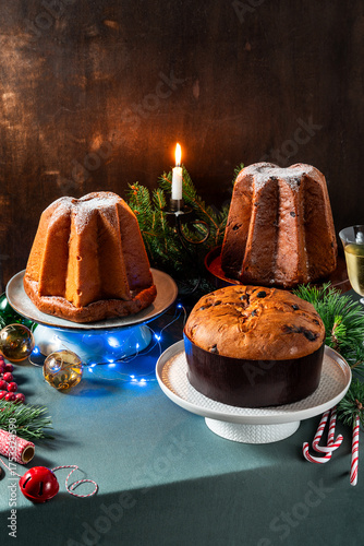 Different types of sweet Italian panettone cakes on a festive Christmas table