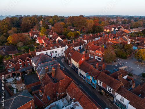 English village rooftops in autumn at sunset