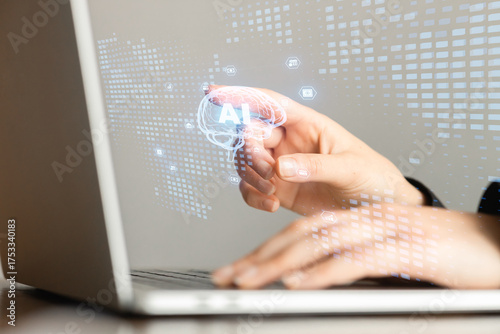 Business technology illustration -hands using laptop representing artificial intelligence education.
