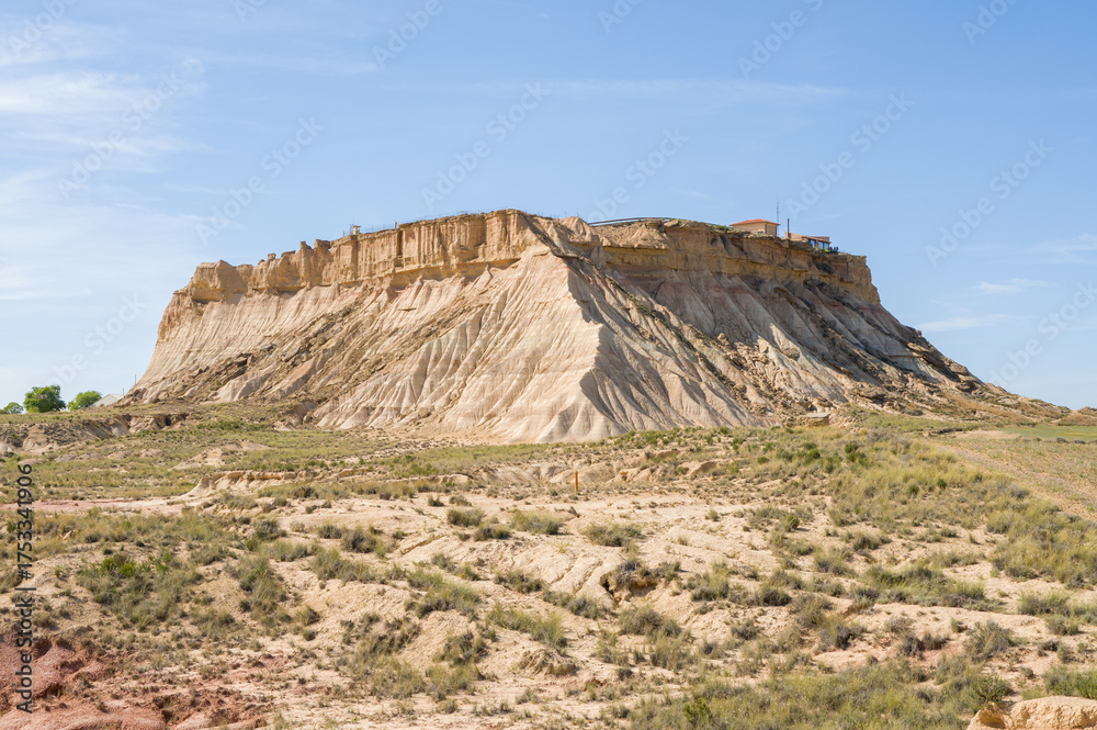 Fototapeta premium This landscape photo was taken in Europe, Spain, Navarre, in summer. It shows the military base in the Bardenas Reales, under the Sun.