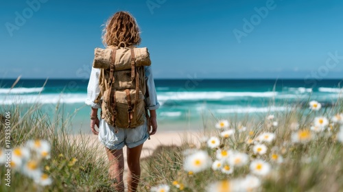 A solitary figure stands at the beach, gazing out at the ocean, surrounded by blooming flowers, embodying a spirit of adventure and serenity in a picturesque landscape.