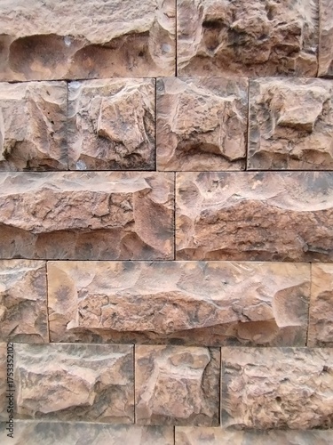 rectangular stone-like wall tiles arranged in a brick pattern