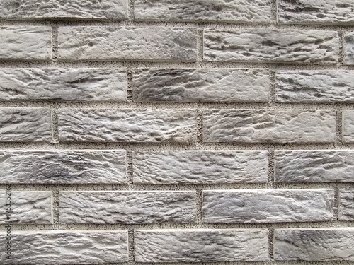 rectangular stone-like wall tiles arranged in a brick pattern