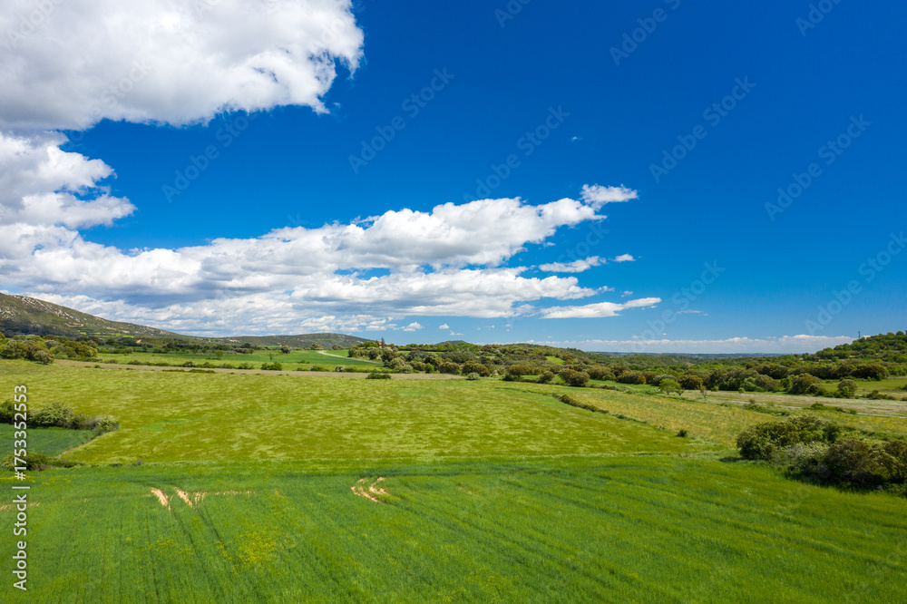 Obraz premium This landscape photo was taken in Europe, Spain, Aragon, Huesca, Samitier, in summer. It shows the fields and mountains around Bierge, under the Sun.