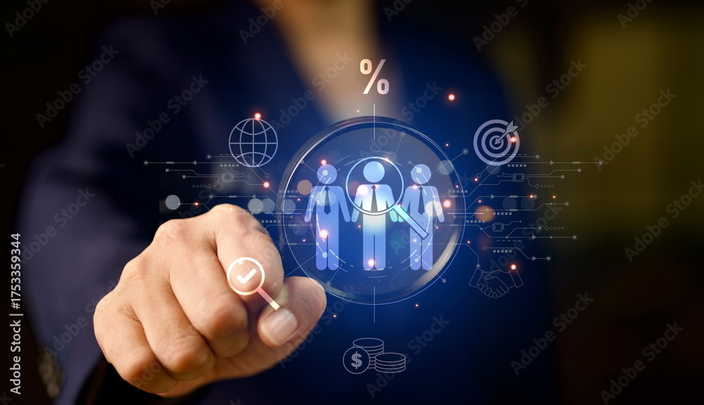 Fototapeta premium Businessman using digital interface for human resource management, recruitment data analysis, and candidate selection concept with technology and innovation in modern business.