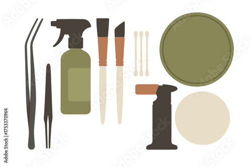 Specialized crafting tools collection including tweezers spray bottle brushes and small torch