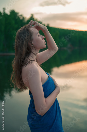 Peaceful woman standing by ...