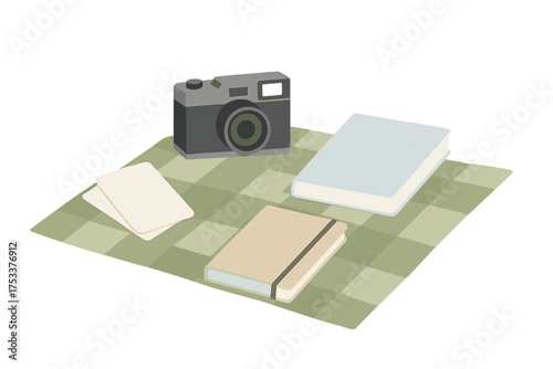Flat lay of vintage camera notebooks and blank cards on checkered mat
