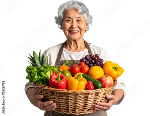 Joyful Senior Woman Holding Basket of Fresh Fruits and Vegetables