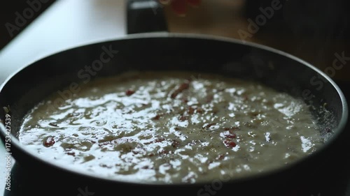 Creamy Carbonara Sauce Cooking on Pan.