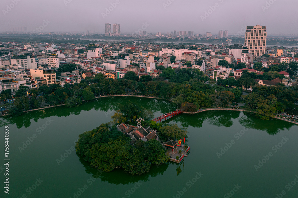 Fototapeta premium The Iconic Turtle Tower (Tháp Rùa) on Hoan Kiem Lake, Hanoi - Aerial Photo Stunning High-Resolution Aerial: Turtle Tower, Hanoi's Legendary Landmark Hoan Kiem Lake's Centerpiece: Turtle Tower Drone 