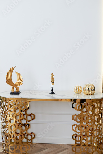 Wallpaper Mural A table with a metallic gold underframe. Luxurious minimalist interior. White and gold palette, Torontodigital.ca