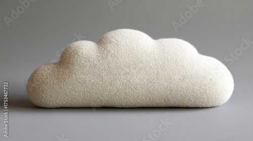 The cloud pillow is a plush and fluffy decorative throw pillow designed for kids' rooms, with its cloud shape and soft background making it a great addition to nursery decor