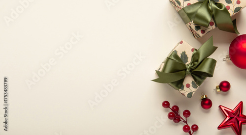 Merry Christmas and Happy Holidays greeting card, frame, banner. New Year. Christmas ornaments and gifts, presents on light beige background top view. Winter xmas holiday festive theme.	
