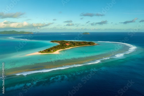 Aerial view of tropical island resort in fiji with turquoise ocean water
