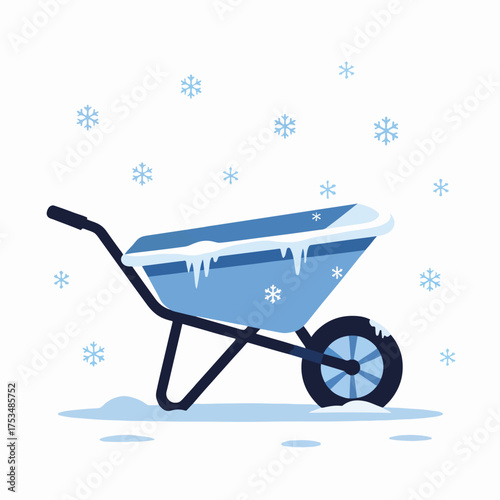 Frosted wheelbarrow on snowy ground with ice crystals falling from sky. Winter scene features blue wheelbarrow covered in frost and snowflakes enhancing the chilly atmosphere.