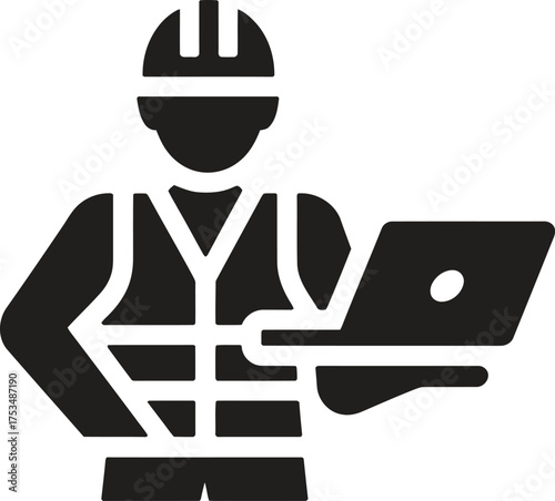 Construction worker in hard hat and safety vest using a laptop