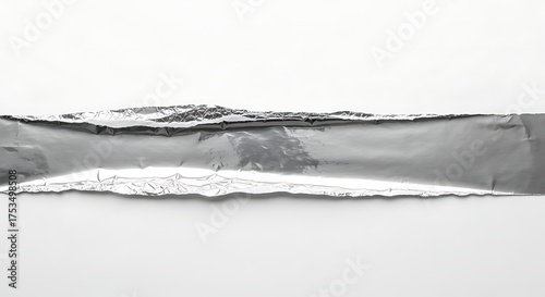 Torn paper edge with a metallic silver foil texture, creating a rough and textured border, isolated on white background