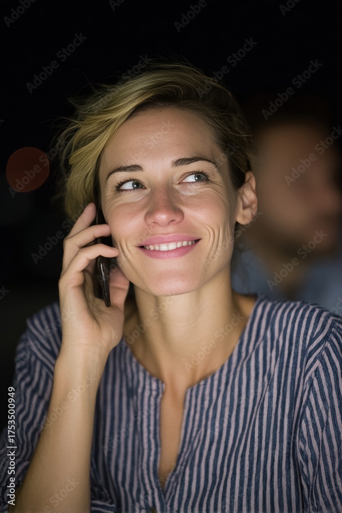 Fototapeta premium Smiling woman, European descent, chatting under moonlit sky, embodies digital nomad dreams, Lunar New Year, and World Smile Day