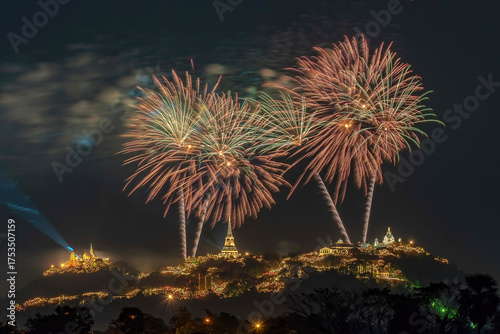 Beautiful fireworks over Phra Nakhon Khiri (Khao Wang Historical Park) in Phetchaburi Province, Thailand. The spectacular display takes place above the beautifully lit palace and temples.