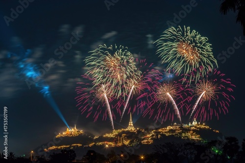 Beautiful fireworks over Phra Nakhon Khiri (Khao Wang Historical Park) in Phetchaburi Province, Thailand. The spectacular display takes place above the beautifully lit palace and temples.