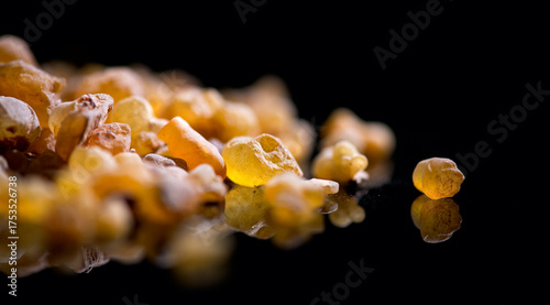 Frankincense olibanum resin, Boswellia sacra Isolated on black background. Frankincense or olibanum aromatic resin for incense and perfumes, medicine, religion concept. Incense, Fragrance border 