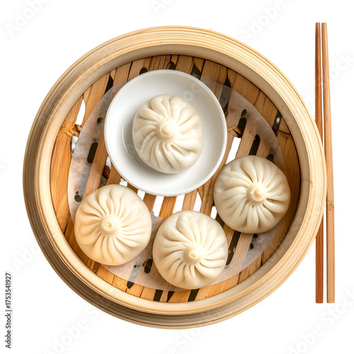 Overhead view of steamed dumplings in a bamboo steamer with chopsticks
